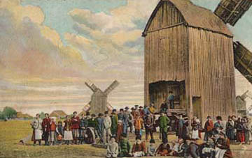 koloriertes Foto: vielen Menschen vor zwei großen Mühlen