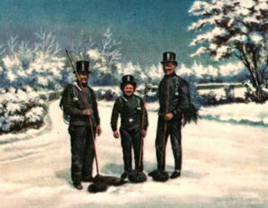 drei Schornsteinfeger im Schnee