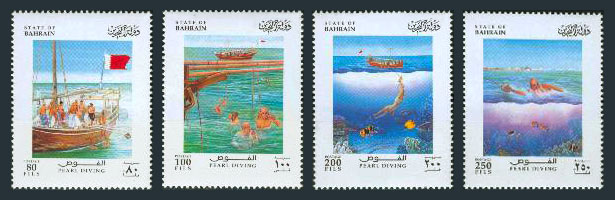 vier Briefmarken mit Szenen vom Perlentauchen