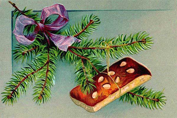 Weihnachtskarte: an Tannenzweig hängender Lebkuchen