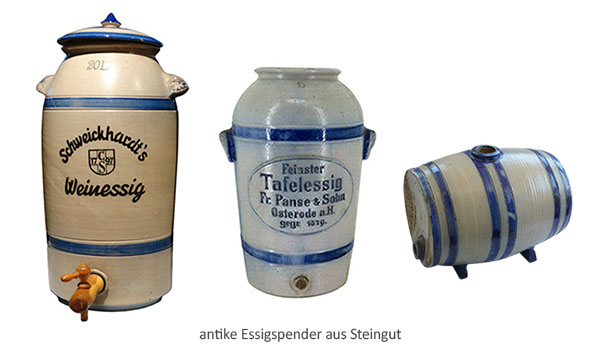 Farbfoto: antike fassförmige Steigut-Essigbehälter mit Holzzapfhahn